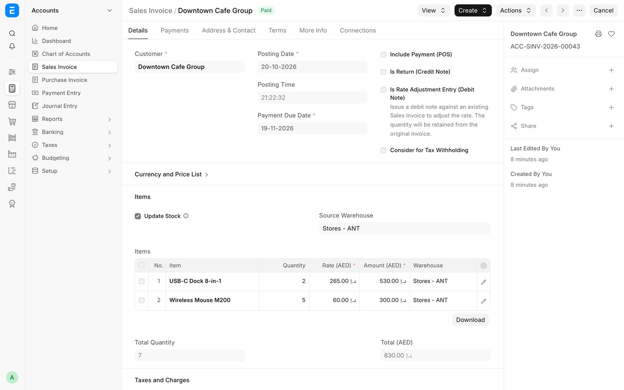 A paid Sales Invoice in ERPNext version 16 for Downtown Cafe Group: two items with quantities, rates in dirhams and the warehouse they ship from